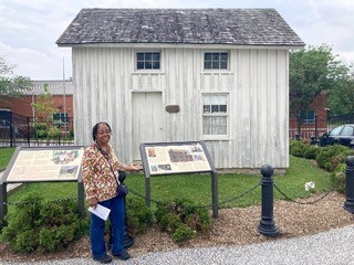 Linda in front of The Jacob House